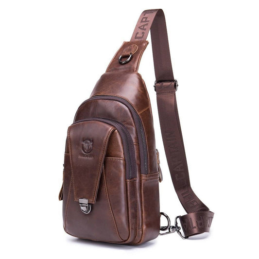 Brown leather sling bag with visible brand name on a white background